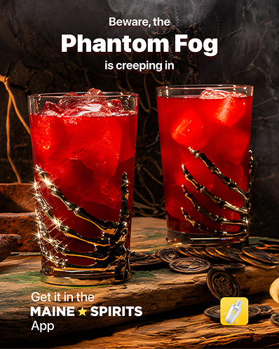 Two vibrant red cocktails adorned with fairy lights on a dark, moody backdrop.