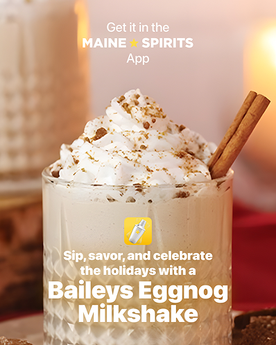 Two vibrant red cocktails adorned with fairy lights on a dark, moody backdrop.